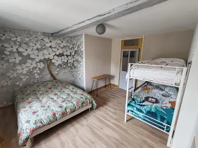 Un ou plusieurs lits dans un hébergement de l'établissement Gîte de la cour Ronty
