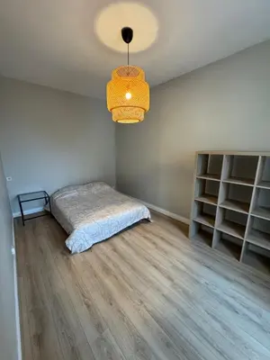 Un ou plusieurs lits dans un hébergement de l'établissement 2 bedroom Apartment Reims