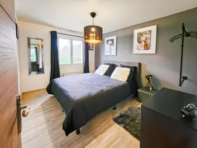 Un ou plusieurs lits dans un hébergement de l'établissement Villa L'Isachrist, Calme, Confort, 20' Disneyland