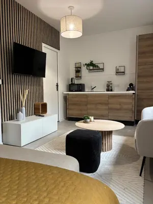 Télévision ou salle de divertissement dans l'établissement Le Lodge