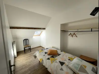 Un ou plusieurs lits dans un hébergement de l'établissement Au gîte du Roy