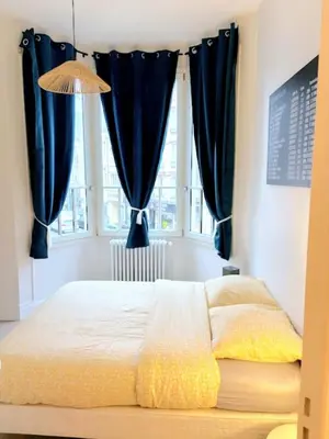 Un ou plusieurs lits dans un hébergement de l'établissement Appartement charmant au pied de la Basilique