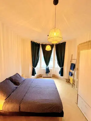 Un ou plusieurs lits dans un hébergement de l'établissement Appartement cosy au cœur de Saint Quentin