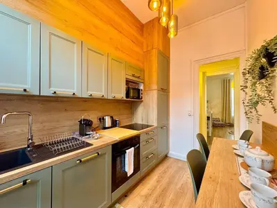 Cuisine ou kitchenette dans l'établissement La suite Jade de Reims - Cathédrale