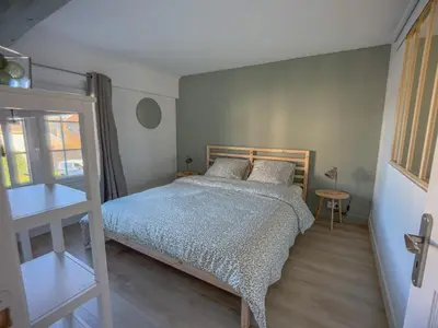 Un ou plusieurs lits dans un hébergement de l'établissement New Lovely cosy house with garden