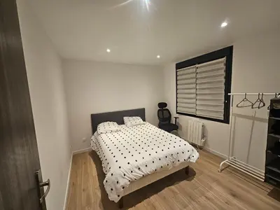 Un ou plusieurs lits dans un hébergement de l'établissement Appartement 75m2 neuf 15 min centre ville