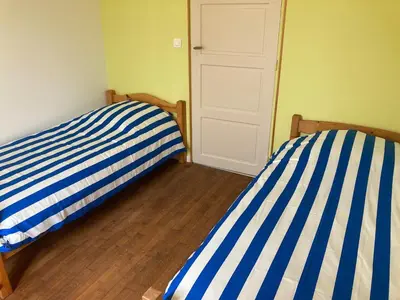Un ou plusieurs lits dans un hébergement de l'établissement Appartement du Moulin