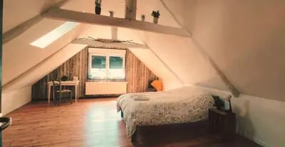 Un ou plusieurs lits dans un hébergement de l'établissement Chambre Privée chez Guillaume
