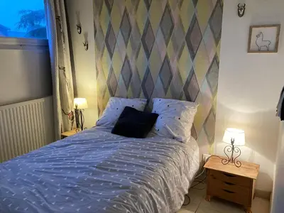 Un ou plusieurs lits dans un hébergement de l'établissement Très Bel appartement