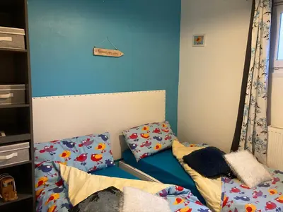 Un ou plusieurs lits dans un hébergement de l'établissement Très Bel appartement