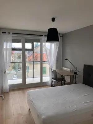 Un ou plusieurs lits dans un hébergement de l'établissement Appartement Venise 2 chambres