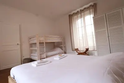 Un ou plusieurs lits dans un hébergement de l'établissement E Le clos des lumières, maison 13 pers avec jardin