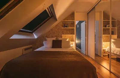 Un ou plusieurs lits dans un hébergement de l'établissement Appartement centre-ville Reims vue Cathédrale