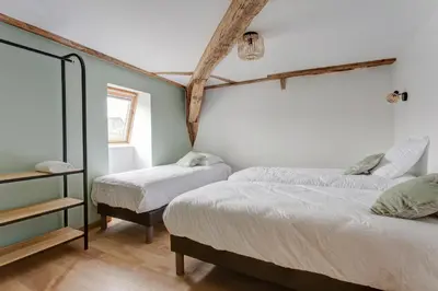 Un ou plusieurs lits dans un hébergement de l'établissement La Clouterie - Face au ruisseau piscine privée