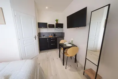 Cuisine ou kitchenette dans l'établissement Le petit joyau de Voltaire