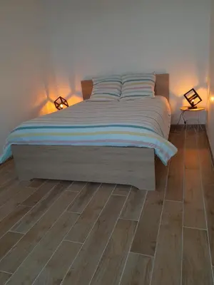 Un ou plusieurs lits dans un hébergement de l'établissement Agréable maison à Antheuil Portes