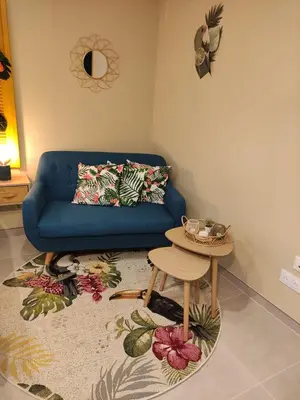 Coin salon dans l'établissement Une virée à deux, gîte et spa