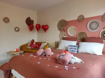 Un ou plusieurs lits dans un hébergement de l'établissement Une virée à deux, gîte et spa