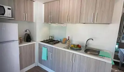 Cuisine ou kitchenette dans l'établissement Camping Le Chêne Gris