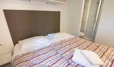 Un ou plusieurs lits dans un hébergement de l'établissement Camping Le Chêne Gris
