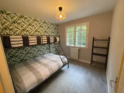 Un ou plusieurs lits dans un hébergement de l'établissement Villa 21 couchages avec piscine interieure chauffée