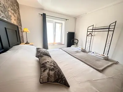 Un ou plusieurs lits dans un hébergement de l'établissement Au clos de jean un havre de paix avec 3 chambres