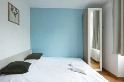 Un ou plusieurs lits dans un hébergement de l'établissement Calme Appart - Centre ville - Cozy Houses