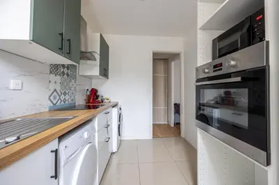 Cuisine ou kitchenette dans l'établissement Calme Appart - Centre ville - Cozy Houses