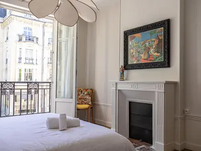 Un ou plusieurs lits dans un hébergement de l'établissement Appartement au pied de la Cathédrale - Reims Centre