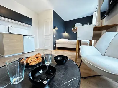 Un ou plusieurs lits dans un hébergement de l'établissement E2 Reton Studio Cosy proche du centre-ville