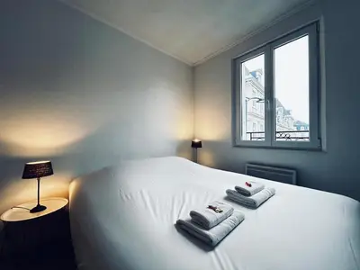 Un ou plusieurs lits dans un hébergement de l'établissement Une bulle en champagne T3 hyper centre avec balcon