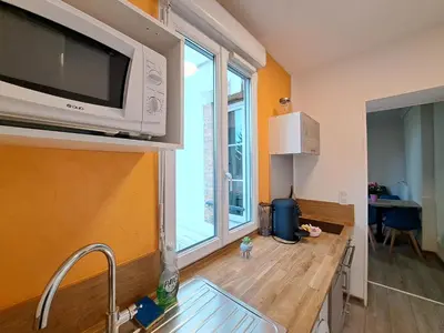 Cuisine ou kitchenette dans l'établissement El Dorado - Proche du centre-ville