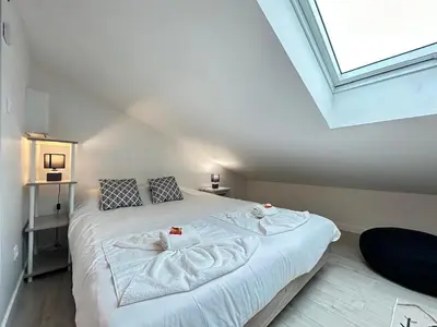 Un ou plusieurs lits dans un hébergement de l'établissement Le pilier G un cocon confortable proche du centre