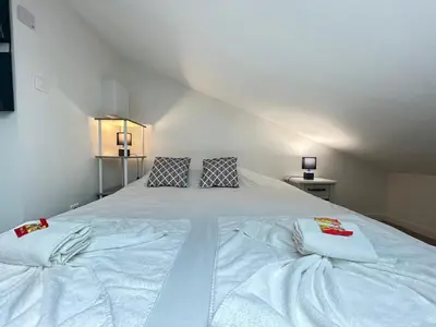 Un ou plusieurs lits dans un hébergement de l'établissement Le pilier G un cocon confortable proche du centre