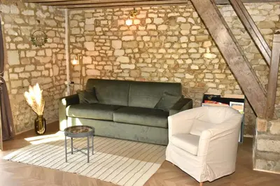 Coin salon dans l'établissement Charmante maisonnette au calme