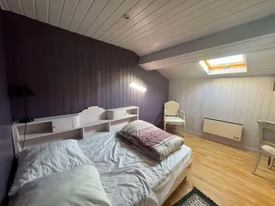 Un ou plusieurs lits dans un hébergement de l'établissement Loft entre vignes et lac