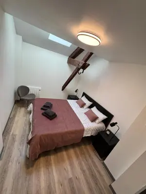 Un ou plusieurs lits dans un hébergement de l'établissement Appartement 2 chambres 6 couchages Witry les Reims