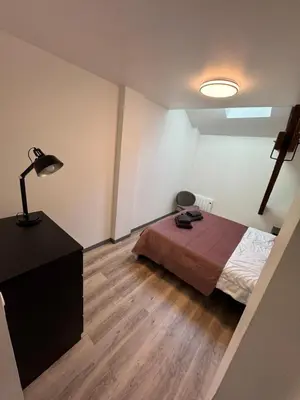 Un ou plusieurs lits dans un hébergement de l'établissement Appartement 2 chambres 6 couchages Witry les Reims