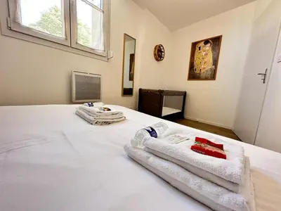 Un ou plusieurs lits dans un hébergement de l'établissement Gite 10 personnes avec jacuzzi à 10 min de Reims