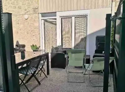 Coin salon dans l'établissement Gite 10 personnes avec jacuzzi à 10 min de Reims