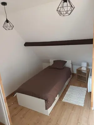 Un ou plusieurs lits dans un hébergement de l'établissement Appartement cosy