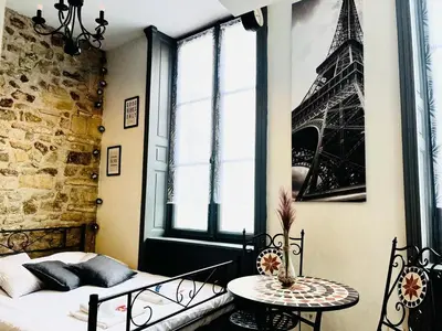 Un ou plusieurs lits dans un hébergement de l'établissement capucin 2 super studio au pied de la cathédrale