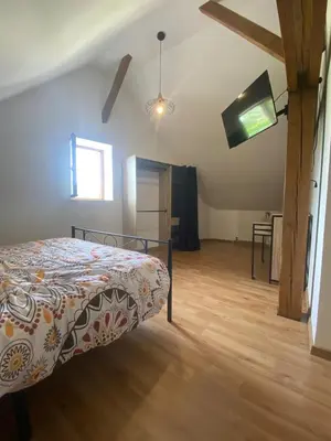 Un ou plusieurs lits dans un hébergement de l'établissement Jolie maisonnette
