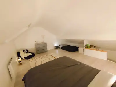 Un ou plusieurs lits dans un hébergement de l'établissement Maison au calme proche A4 Disney Petit déjeuner possible