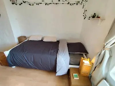 Un ou plusieurs lits dans un hébergement de l'établissement Maison au calme proche A4 Disney Petit déjeuner possible