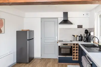 Cuisine ou kitchenette dans l'établissement Appartement plein centre 