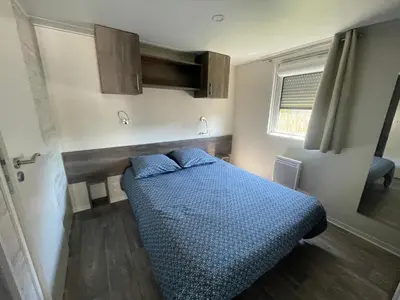 Un ou plusieurs lits dans un hébergement de l'établissement Chalet Bois