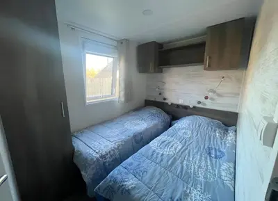Un ou plusieurs lits dans un hébergement de l'établissement Chalet Bois