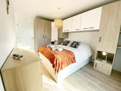 Un ou plusieurs lits dans un hébergement de l'établissement Chez Pablo, maison avec jardin et parking privé