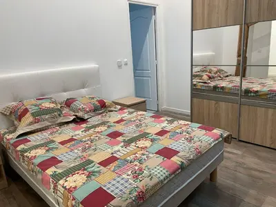 Un ou plusieurs lits dans un hébergement de l'établissement APPARTEMENT MODERNE DANS FERME DU 13éme SIECLE
